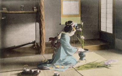Girl arranging flowers by Japanese Photographer